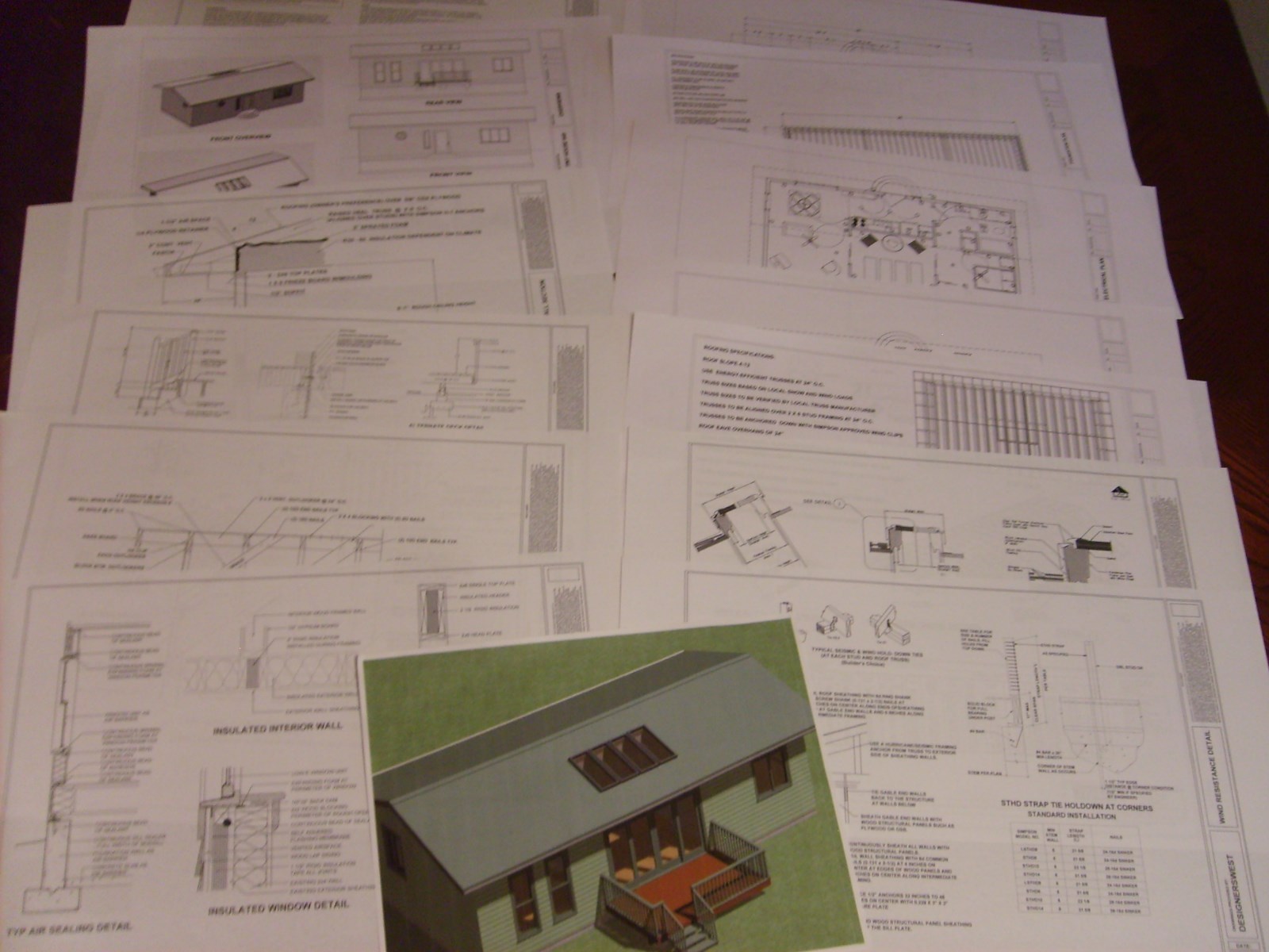 Small Home Construction Plans 648 sq.ft. with outdoor deck and sunroom.